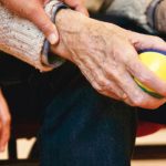 Stock photograph of a carer supporting an elderly person